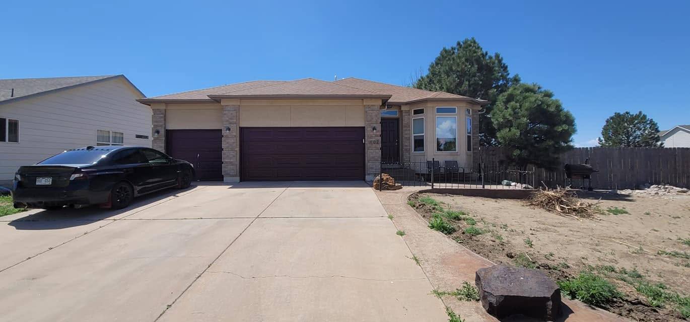 Finished exterior repaint of a home with attached garage